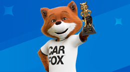 Cartoon fox holding a trophy